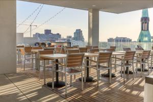 a row of tables and chairs on a roof at Omni Louisville Hotel in Louisville