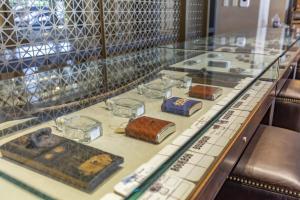 a display case filled with lots of glass items at Omni Louisville Hotel in Louisville