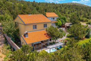 an aerial view of a house with a swimming pool at House Rukavina Senj in Senj
