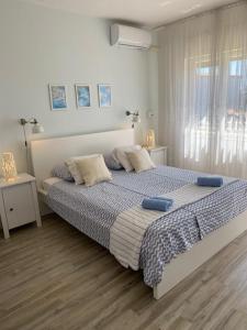 Łóżko lub łóżka w pokoju w obiekcie Kosovic Family House