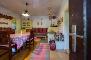 a dining room with a table and some chairs at Chalupa u Janov in Mýto pod Ďumbierom