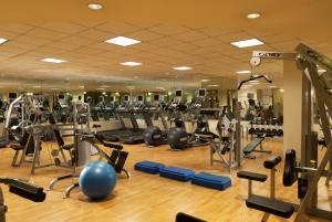 a gym with a lot of tread machines at Boston Omni Parker House Hotel in Boston