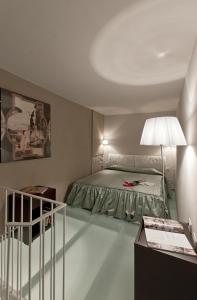 Säng eller sängar i ett rum på Borgo Suite