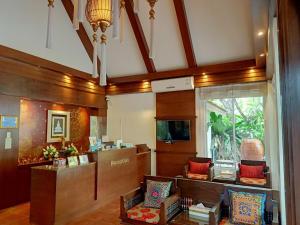 a lobby with a waiting room with a reception desk at Rommai Greenpark in Lampang
