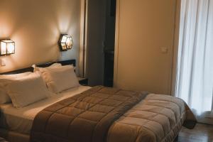 Letto o letti in una camera di Hôtel & Résidence Le Subrini