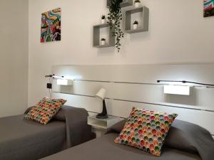 Кровать или кровати в номере AliceA apartment in Siracusa