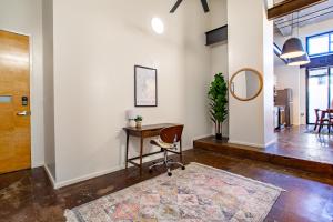 an office with a desk and a mirror at Urban Sterchi Lofts - Downtown Knoxville in Knoxville