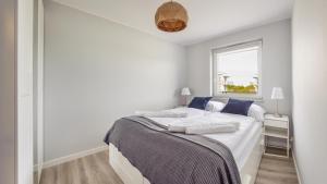 Postel nebo postele na pokoji v ubytování Prywatne apartamenty Sun & Snow w Porta Mare