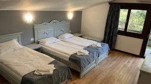 Un pat sau paturi într-o cameră la Casa de vacanta TARA