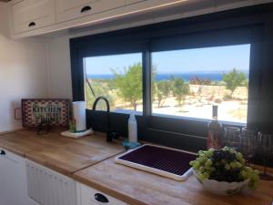 Kuchyň nebo kuchyňský kout v ubytování Zeytinycesme l Tiny Houses & Farm l Çeşme
