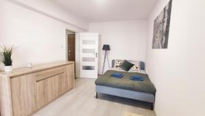 Posteľ alebo postele v izbe v ubytovaní Dąbska 18D by Homeprime