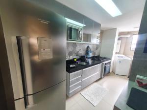 Kuchyň nebo kuchyňský kout v ubytování Apartamentos 250m da Orla -Edifício Nugali- Castelo B Temporada + 37 fotografií