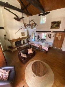 an overhead view of a living room with a table at Calouze in Gijounet