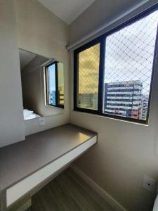 Rúm í herbergi á Apartamentos 250m da Orla -Edifício Nugali- Castelo B Temporada