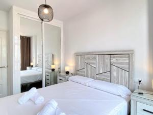 Postel nebo postele na pokoji v ubytování Nevada Centro Casasol + 21 fotografií