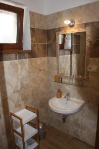 a bathroom with a sink and a mirror at Apartmány Planina Predná Hora in Predná Hora