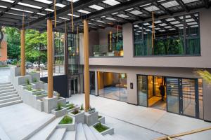 an external view of a building with plants at The Emporium Hotel Plovdiv MGallery Collection in Plovdiv