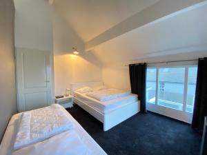 En eller flere senge i et værelse på Ooghduyne 246
