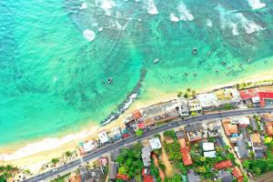 an aerial view of a beach and the ocean at Tamara Motels in Hikkaduwa