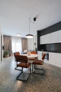 a dining room with a table and some chairs at The Artisan Suites in Athens +116 photos