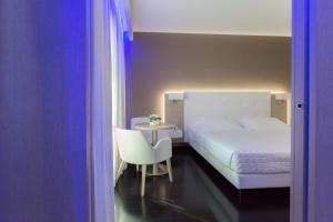 Postel nebo postele na pokoji v ubytování Raffaello Hotel & Mooka Restaurant