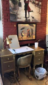 an office with a desk and a painting on the wall at Highland Park Pittsburgh in Pittsburgh