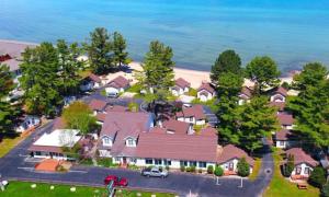 an aerial view of a house with the ocean at Beach House Lakeside Cottages in Mackinaw City