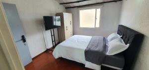 Postel nebo postele na pokoji v ubytování Portal Norte 170 ACOGEDORAS HABITACIONES CON TODOS LOS SERVICIOS