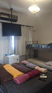 Ένα ή περισσότερα κρεβάτια σε δωμάτιο στο Pousada Corumba Center
