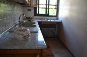 Dapur atau dapur kecil di il Cigno Reale-Green-Rooms Leasing Touristic Ragusa