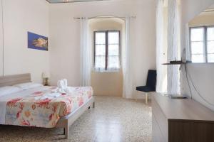 Posteľ alebo postele v izbe v ubytovaní Acciuga House