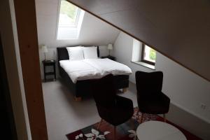 Voodi või voodid majutusasutuse L'auberge de Noiraigue toas