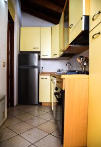 Kuchyň nebo kuchyňský kout v ubytování B&B Demetra Appartamenti