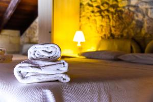 Postel nebo postele na pokoji v ubytování B&B Demetra Appartamenti