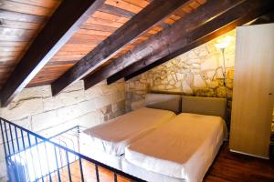 Postel nebo postele na pokoji v ubytování B&B Demetra Appartamenti