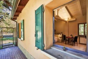 an open door to a patio with a bedroom at CARLOTTA FIERA SUITE in Bologna