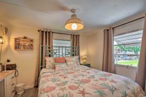 A bed or beds in a room at Homosassa Retreat with Sunroom and Canal Views!
