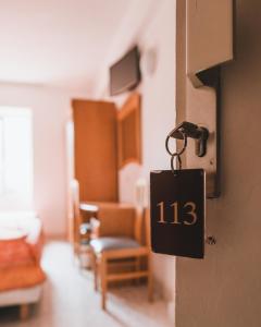 Postel nebo postele na pokoji v ubytování Hôtel Idéal