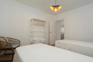 Un pat sau paturi într-o cameră la Villa Santa Maria Playa Grupo AC Gestion
