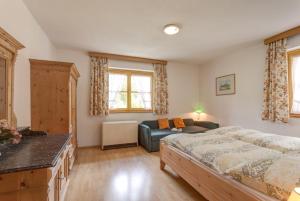 Postel nebo postele na pokoji v ubytování Gartenwohnung Mandl Garten Sauna Hot Pot Pool