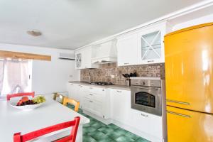 Kuchyň nebo kuchyňský kout v ubytování Casa Desiree + 23 fotografií