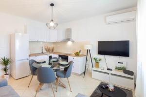 TV a/nebo společenská místnost v ubytování Apartman BILI