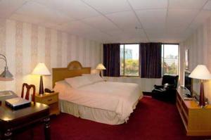 מיטה או מיטות בחדר ב-Amsterdam Hotel