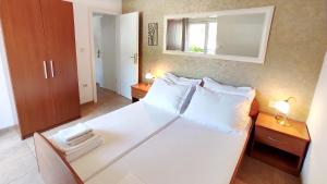 Postel nebo postele na pokoji v ubytování Apartments Marino
