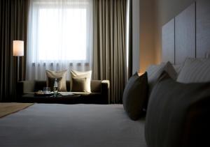A bed or beds in a room at Domina Milano Fiera