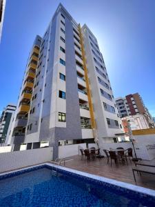 Sundlaugin á Apartamentos 250m da Orla -Edifício Nugali- Castelo B Temporada eða í nágrenninu