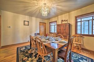 a dining room with a wooden table and chairs at Sault Ste Marie Historic Home, Walk to Town! in Sault Ste. Marie