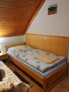 Postel nebo postele na pokoji v ubytování Pod palmou Gerlachov