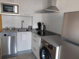 Kuchyňa alebo kuchynka v ubytovaní Apartamento Victoria Plaza