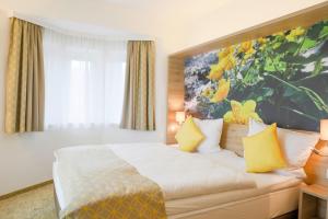Postelja oz. postelje v sobi nastanitve R&R Residenzen HOTEL